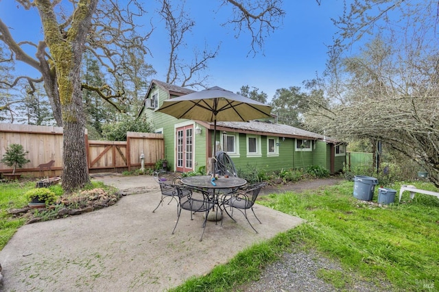 view of patio / terrace featuring a gate and fence