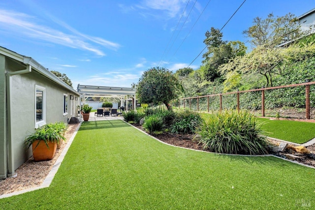 view of yard with fence and a patio