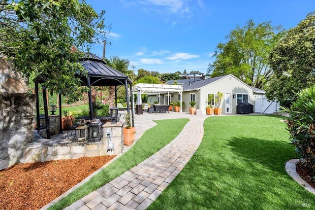 view of yard with a patio and a gazebo