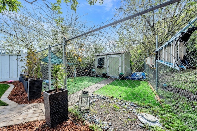 view of yard featuring an outbuilding, a fenced backyard, central AC unit, a storage unit, and a vegetable garden