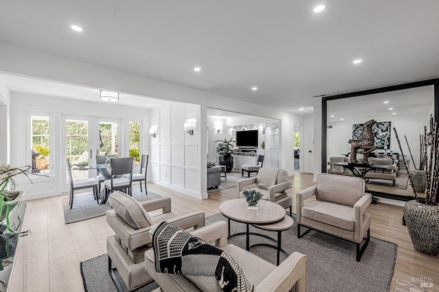 living room featuring recessed lighting and light wood-type flooring