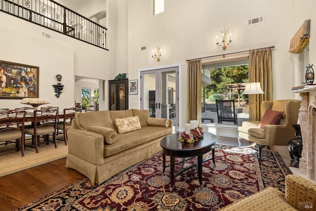 living room featuring visible vents and a healthy amount of sunlight