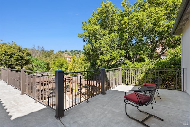 view of patio featuring a balcony