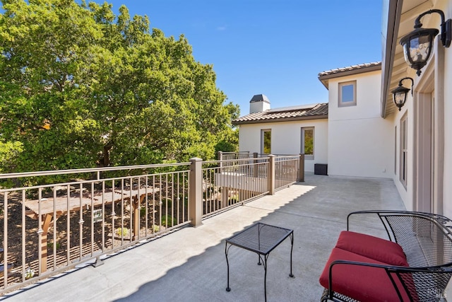 view of patio / terrace with a balcony