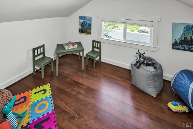 rec room featuring baseboards, vaulted ceiling, and wood finished floors