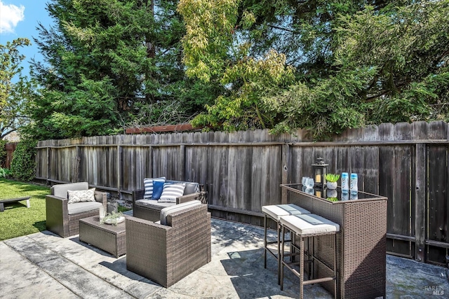 view of patio featuring a fenced backyard and an outdoor hangout area