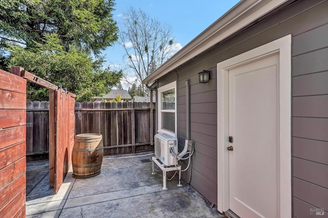 view of patio featuring fence