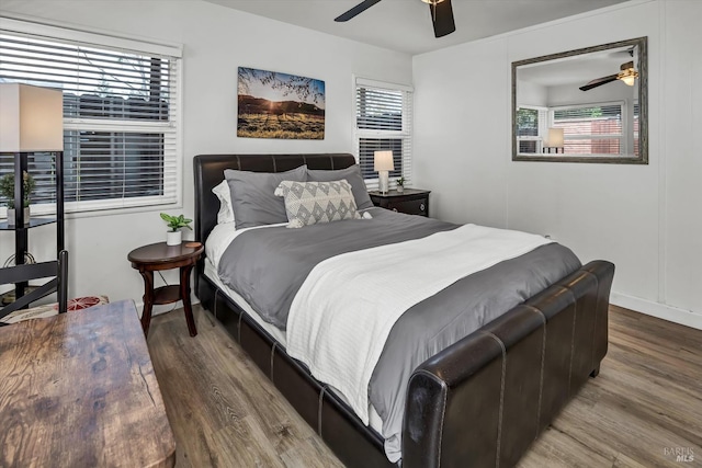 bedroom featuring wood finished floors and a ceiling fan