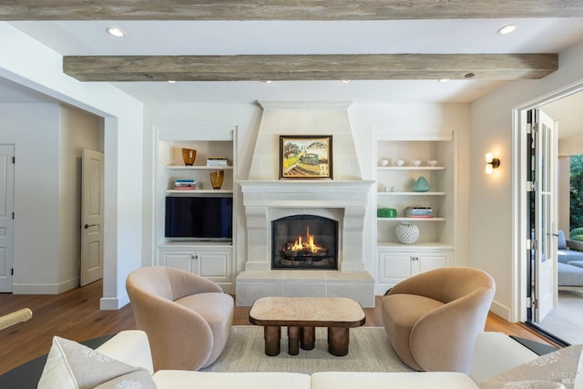 1149 Hudson Ave, Saint Helena, CA 94574 - living area with wood finished floors, built in features, a tile fireplace, beamed ceiling, and baseboards