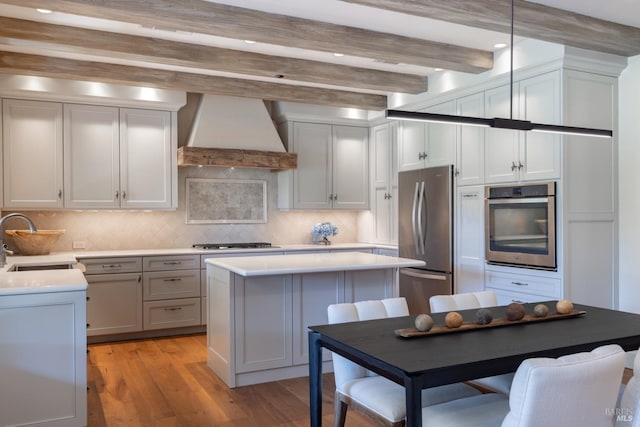 1149 Hudson Ave, Saint Helena, CA 94574 - kitchen with stainless steel appliances, beam ceiling, a sink, light countertops, and premium range hood