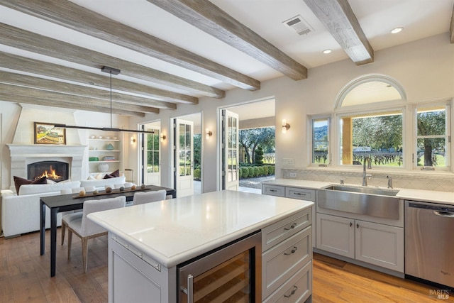 1149 Hudson Ave, Saint Helena, CA 94574 - kitchen featuring stainless steel dishwasher, a sink, light countertops, beam ceiling, and wine cooler