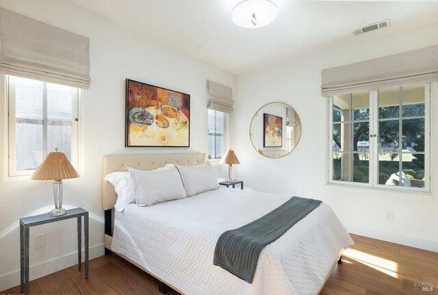 1149 Hudson Ave, Saint Helena, CA 94574 - bedroom featuring baseboards, wood finished floors, and visible vents