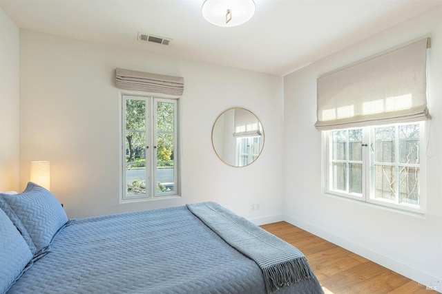 1149 Hudson Ave, Saint Helena, CA 94574 - bedroom with light wood-type flooring, visible vents, and baseboards