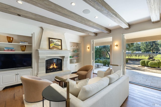 1149 Hudson Ave, Saint Helena, CA 94574 - living room with a tiled fireplace, built in features, recessed lighting, beamed ceiling, and wood finished floors