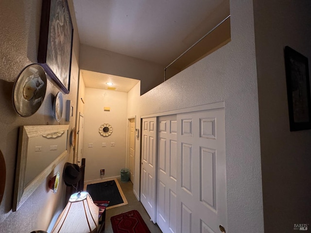 hall with a textured wall