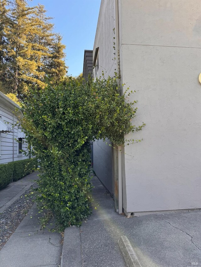 view of side of property featuring stucco siding