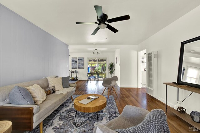 624 Annette Ave, Vallejo, CA 94591 - living area with a heating unit, wood finished floors, a ceiling fan, a chandelier, and baseboards