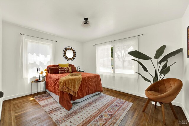 624 Annette Ave, Vallejo, CA 94591 - bedroom with multiple windows, wood finished floors, and baseboards