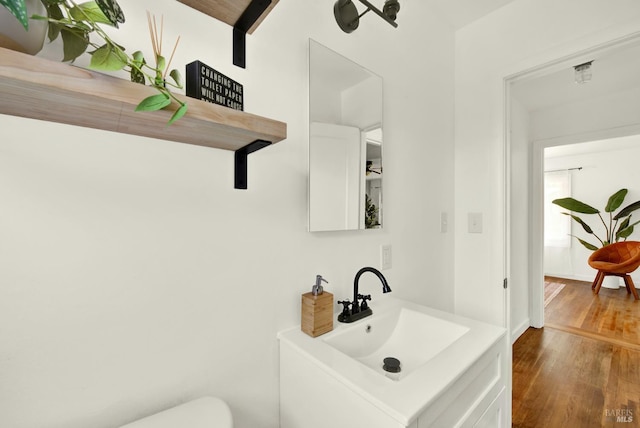 624 Annette Ave, Vallejo, CA 94591 - half bathroom featuring wood finished floors, vanity, and toilet