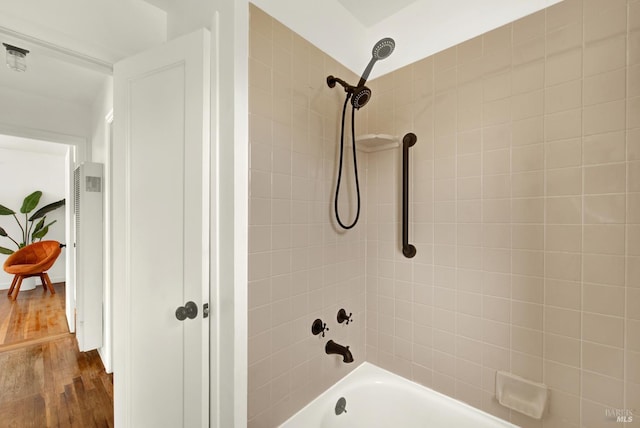 624 Annette Ave, Vallejo, CA 94591 - bathroom with a heating unit, wood finished floors, and shower / bath combination