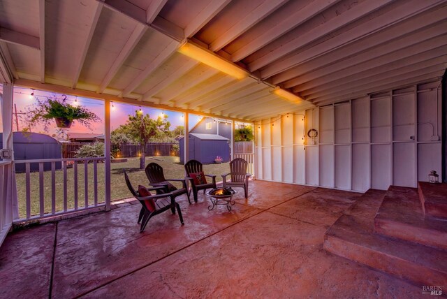 624 Annette Ave, Vallejo, CA 94591 - patio terrace at dusk featuring a storage shed, a fenced backyard, and an outdoor structure