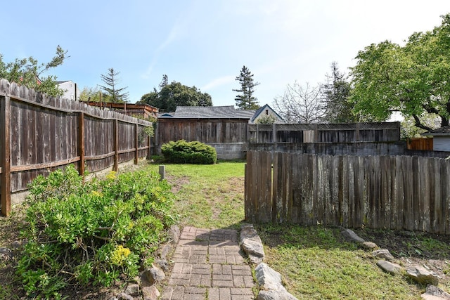 view of yard with a fenced backyard