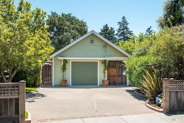 exterior space with a gate and driveway