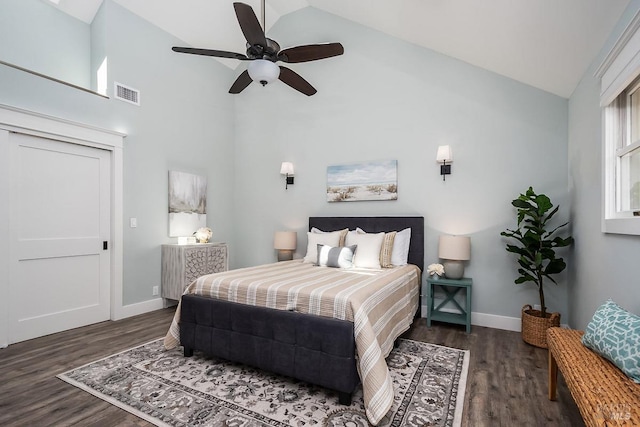 bedroom with high vaulted ceiling, visible vents, baseboards, and wood finished floors