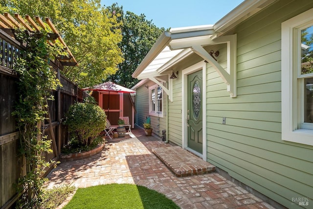 view of patio featuring fence