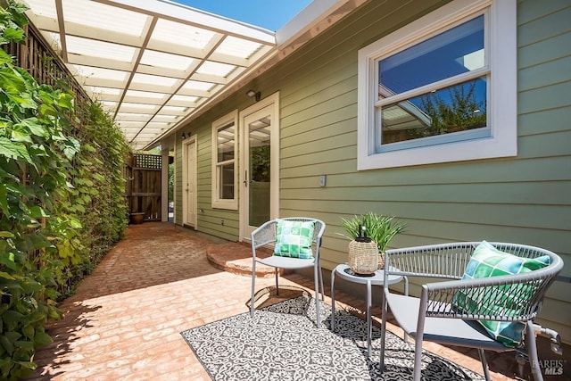 view of patio featuring fence and a pergola