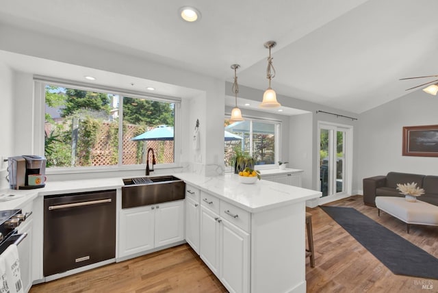 280 Park St, Concord, CA 94520 - kitchen featuring appliances with stainless steel finishes, a sink, open floor plan, a peninsula, and vaulted ceiling
