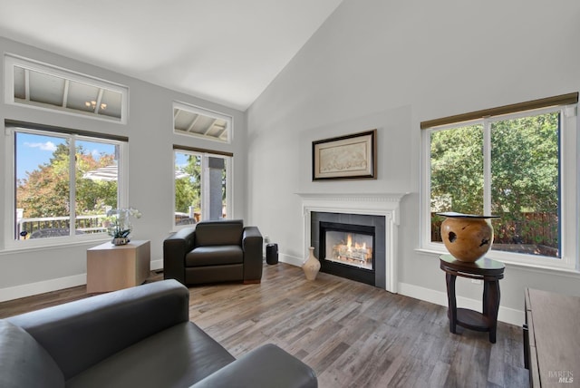 280 Park St, Concord, CA 94520 - living area with a tile fireplace, wood finished floors, high vaulted ceiling, and baseboards
