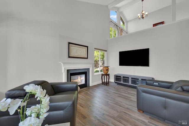 280 Park St, Concord, CA 94520 - living area featuring a chandelier, wood finished floors, a glass covered fireplace, high vaulted ceiling, and beam ceiling