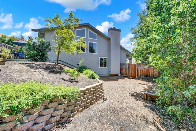 280 Park St, Concord, CA 94520 - back of house with fence, a chimney, and stucco siding