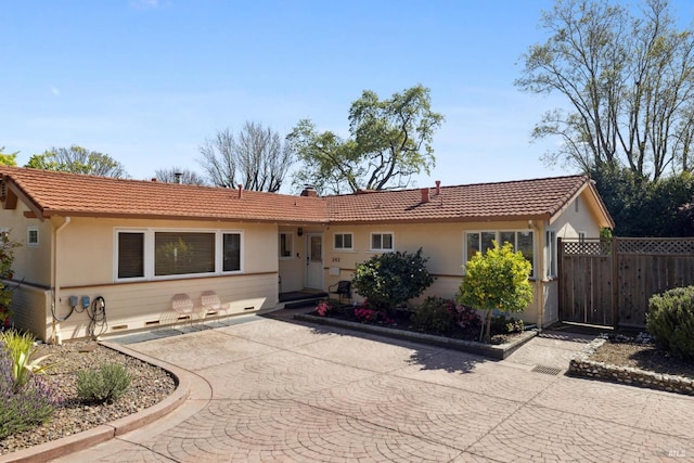 back of house with fence, outdoor dining area, stucco siding, an outdoor hangout area, and a chimney