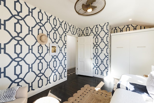 bedroom with vaulted ceiling, recessed lighting, dark wood-type flooring, baseboards, and wallpapered walls