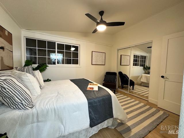 1242 Van Buren St, Fairfield, CA 94533 - bedroom featuring wood finished floors, a closet, lofted ceiling, and a ceiling fan