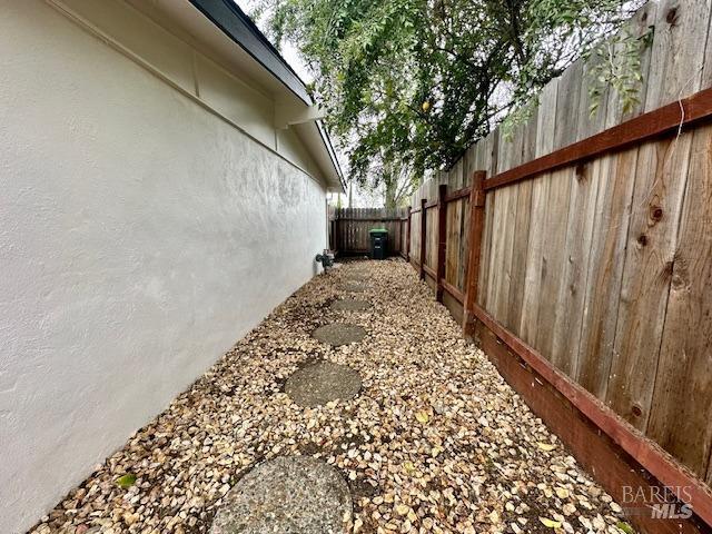1242 Van Buren St, Fairfield, CA 94533 - view of home's exterior with fence, central air condition unit, and stucco siding