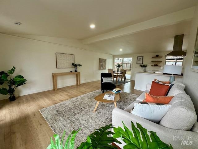 1242 Van Buren St, Fairfield, CA 94533 - living room with wood finished floors, beam ceiling, baseboards, and recessed lighting