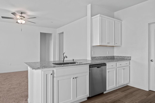 kitchen with a sink, dishwasher, a peninsula, a ceiling fan, and white cabinetry
