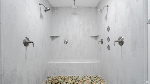 full bath with a tile shower