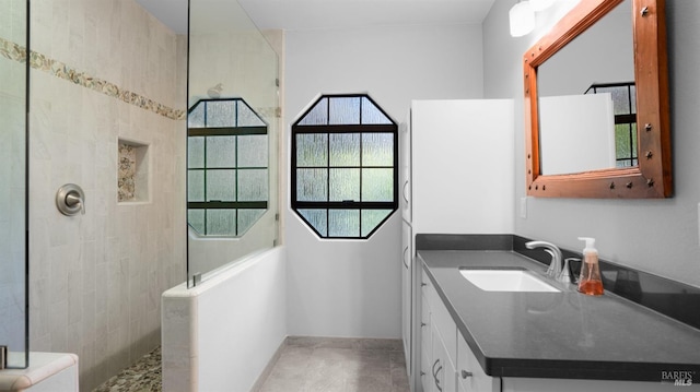 bathroom with vanity and walk in shower