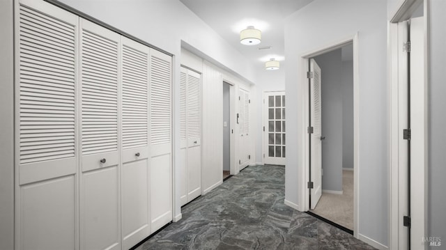 hall featuring baseboards