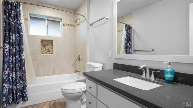 bathroom featuring toilet, vanity, and shower / bath combo