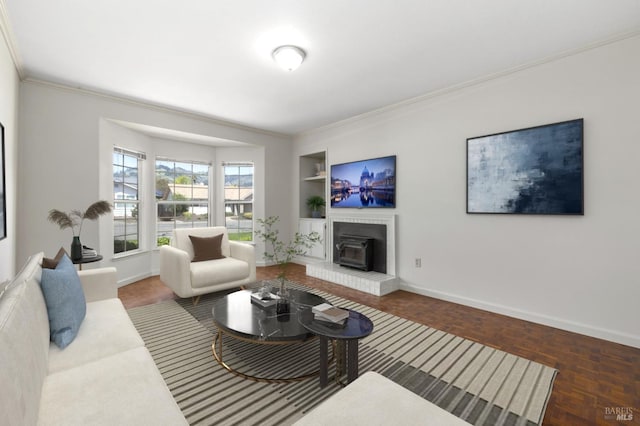 living area with ornamental molding, built in features, and baseboards