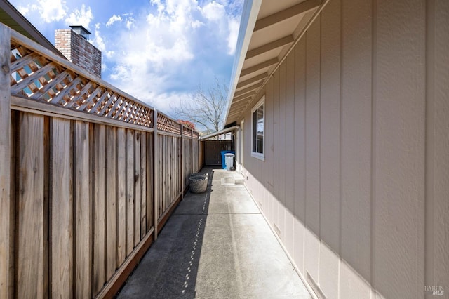 view of side of home with fence