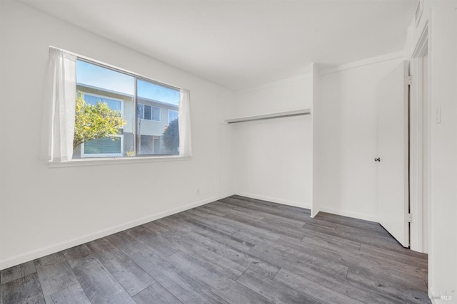 1008 Los Gamos Rd Unit F, San Rafael, CA 94903 - unfurnished bedroom featuring wood finished floors and baseboards
