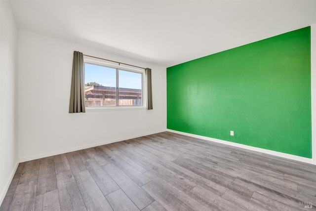 1008 Los Gamos Rd Unit F, San Rafael, CA 94903 - empty room with hardwood / wood-style flooring and baseboards