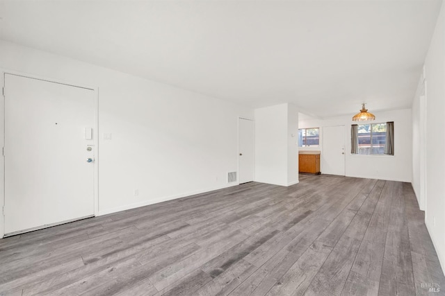 1008 Los Gamos Rd Unit F, San Rafael, CA 94903 - unfurnished living room featuring wood finished floors