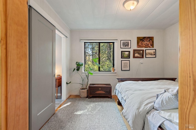 bedroom with wood finished floors